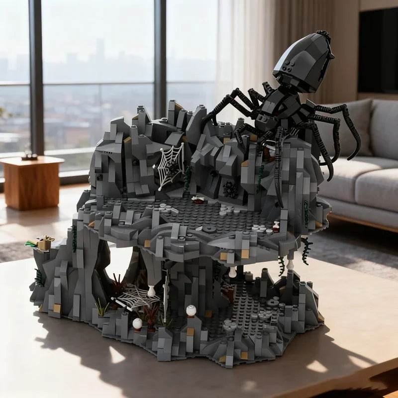 Close-up of Shelob's Lair model set showing intricate spider sculpture in black and gray.