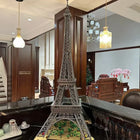 Eiffel Tower building block model displayed on a surface, angled view