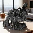 Close-up of Shelob's Lair model set showing intricate spider sculpture in black and gray.