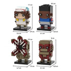 JAKI Brick Head Z Building Blocks Set with various assembled models on display